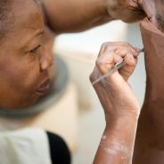 Close up of female working with clay