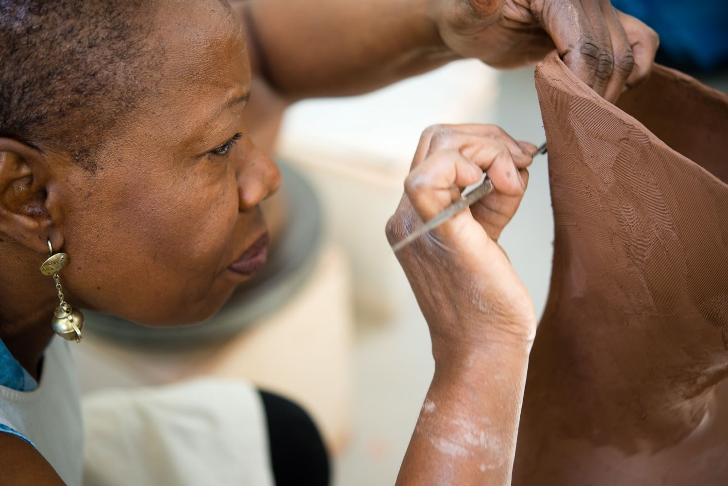 Close up of female working with clay