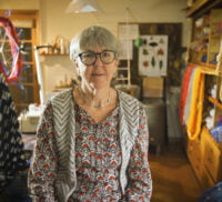 Female is a studio surrounded by knitting and wool