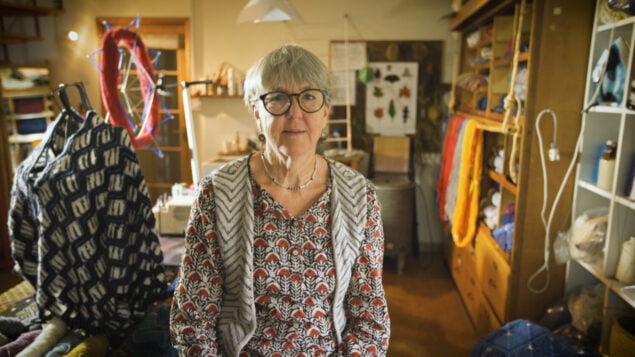 Female is a studio surrounded by knitting and wool