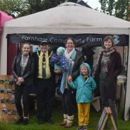 Group of people in front of small marquee