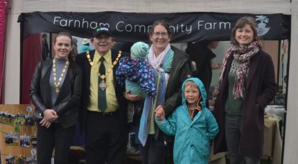 Group of people in front of small marquee