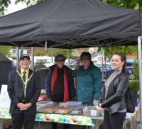 Mayor and Mayoress standing in front of a tea tent.