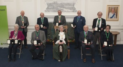 Group of people with Mayor front centre.