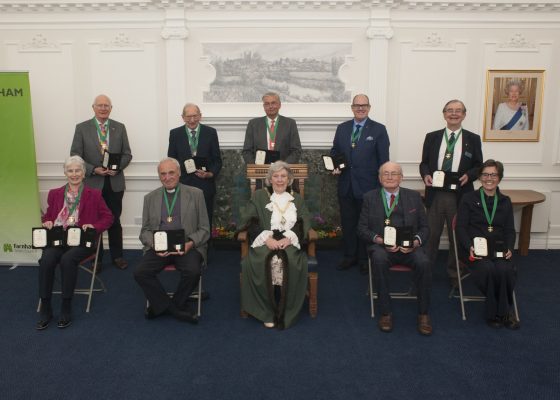 Group of people with Mayor front centre.