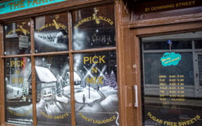 Snowy scene painted on a shop window