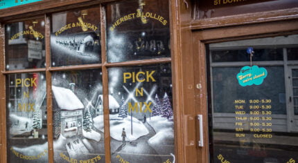 Snowy scene painted on a shop window