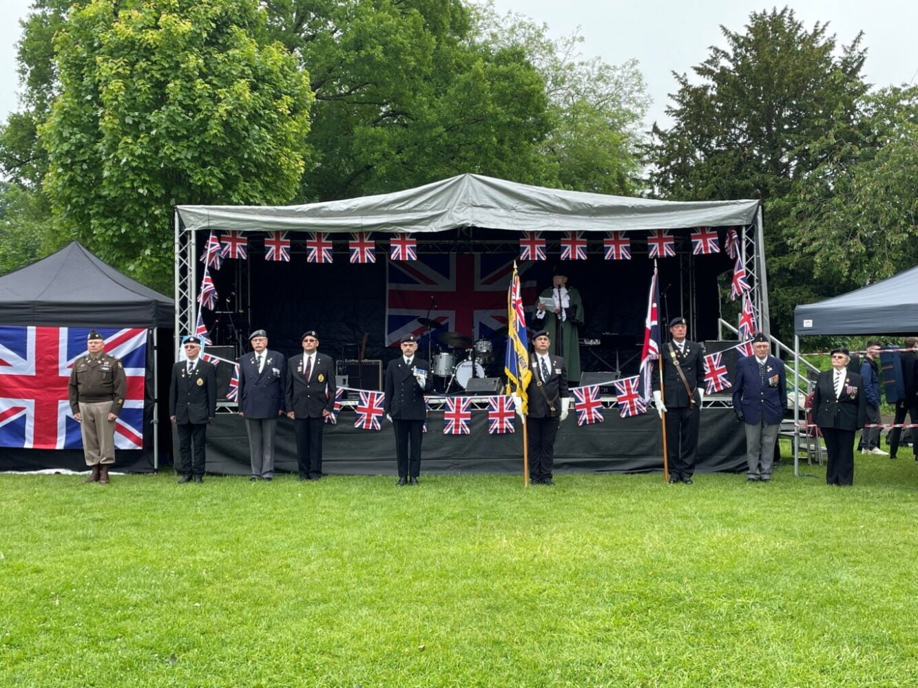 Stage with members of the British Legion in front