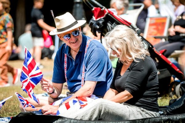 Two people holding Union flags