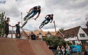 Two stunt bike riders on a ramp