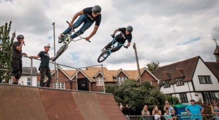 Two stunt bike riders on a ramp