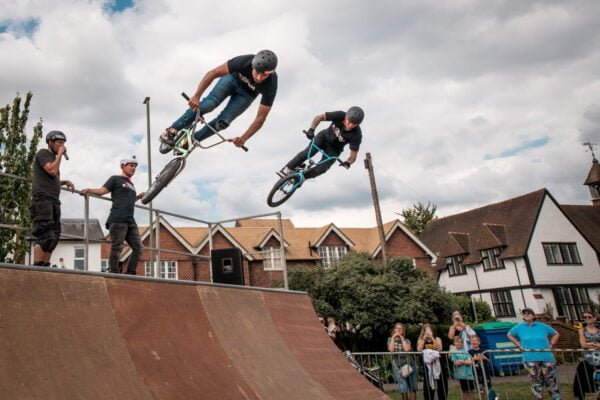 Two stunt bike riders on a ramp