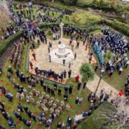 Aerial image of people taking part in a service at the war memorial