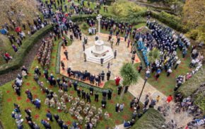 Aerial image of people taking part in a service at the war memorial