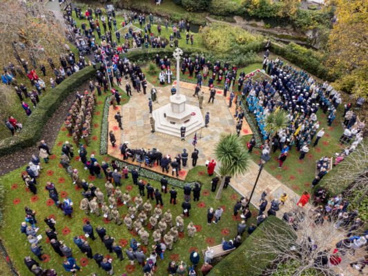 Aerial image of people taking part in a service at the war memorial