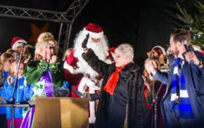 Pantomime characters, Father Christmas and a female waving