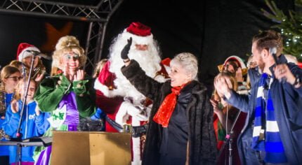 Pantomime characters, Father Christmas and a female waving