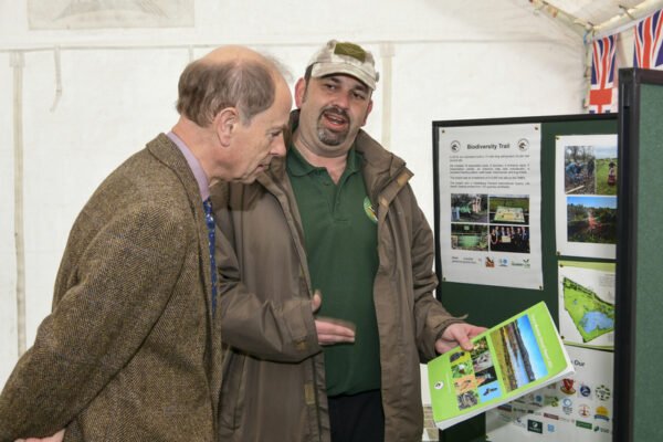 HRH The Duke of Edinburgh talking to a man