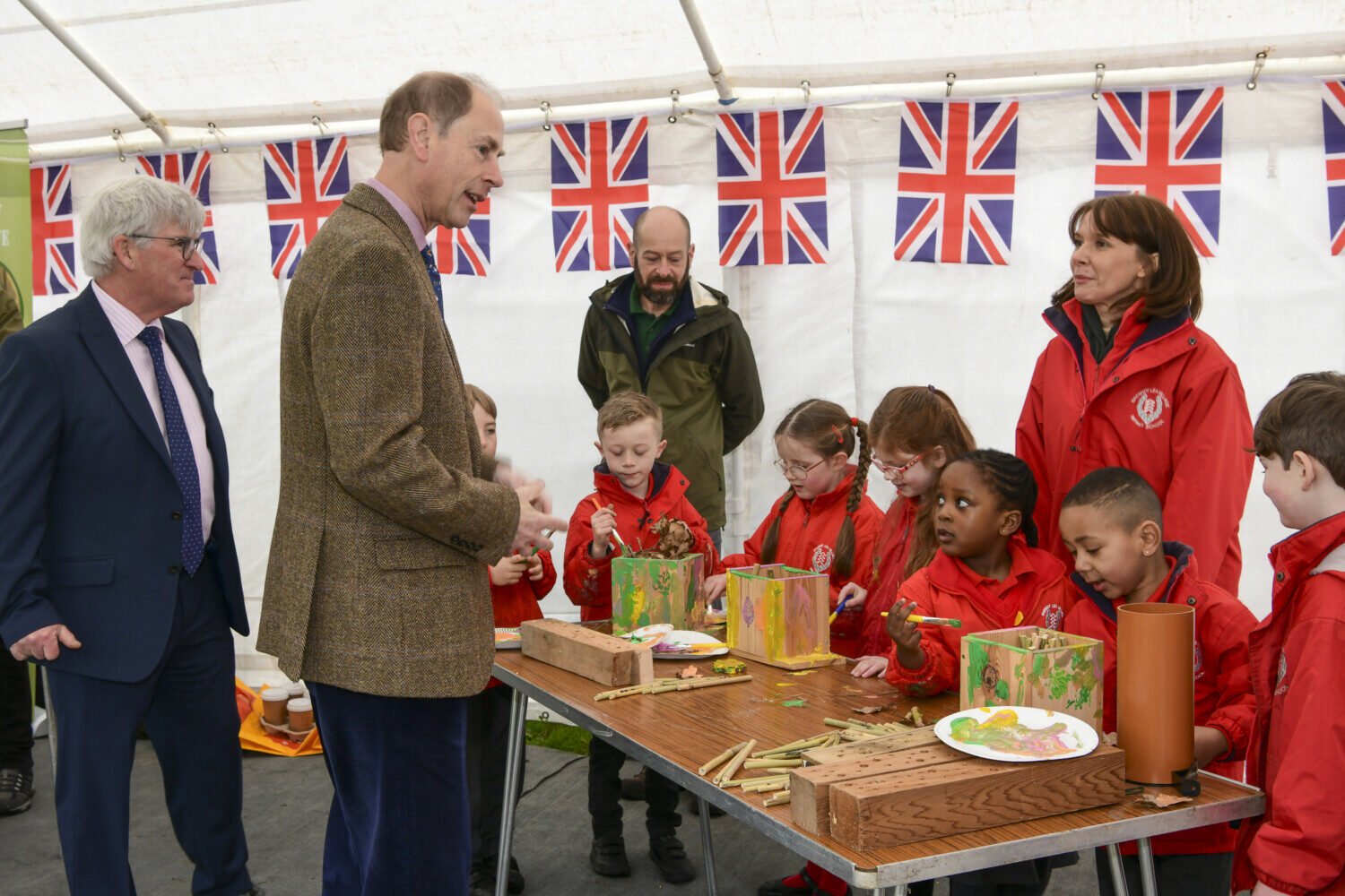 HRH The Duke of Edinburgh talks to children making bird boxes