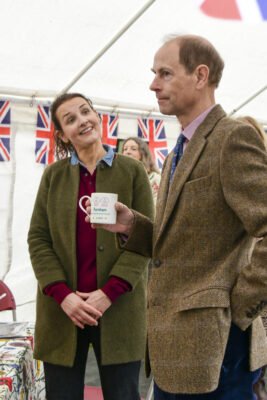 HRH The Duke of Edinburgh holding a mug.