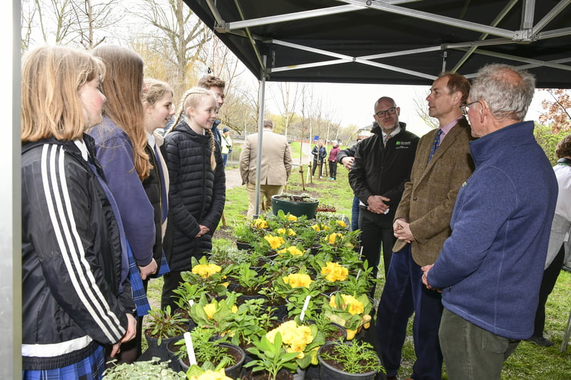 HRH The Duke of Edinburgh talking to older school children