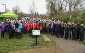 Large group of adults and children.