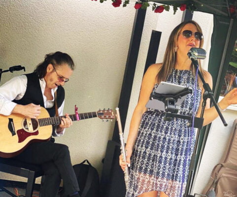 Male guitarist and female singing.