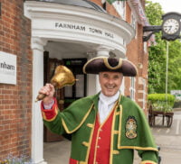 Town crier ringing a bell