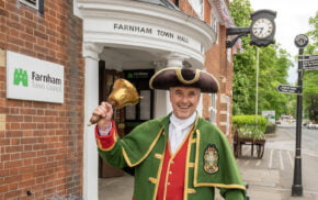 Town crier ringing a bell