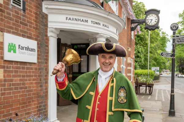 Town crier ringing a bell