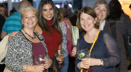 Group of four females enjoying a gin cocktail.