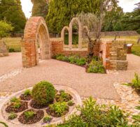 Garden set amidst chapel ruins.