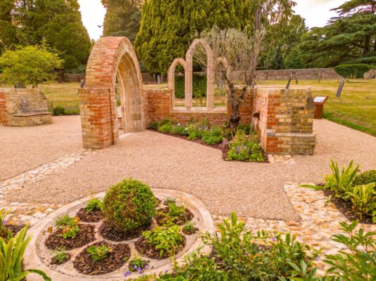 Garden set amidst chapel ruins.