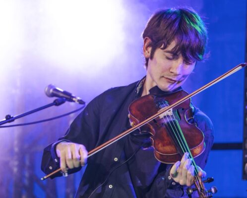 A photo of Ryan Young playing the fiddle