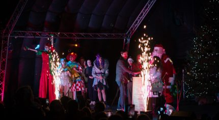 People on stage at Christmas lights switch-on