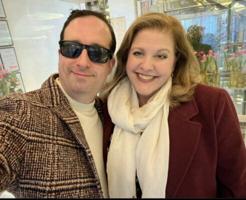 Man and woman smiling.