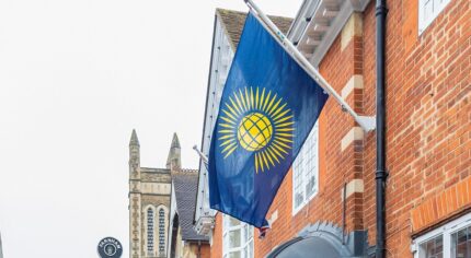 Commonwealth flag on side of building.