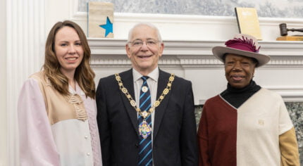 Two females standing with the Mayor.