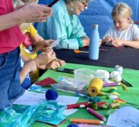 Children and adults crafting.