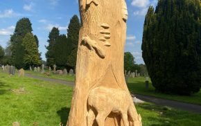 Animals carved from a tree trunk.