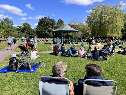 Groups of people sitting in a park
