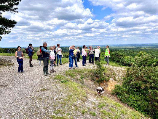 Group of people standing on a hill