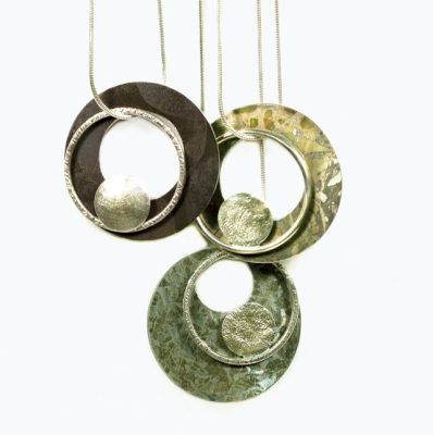 artwork showing hanging circular golden shapes