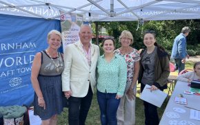 Mayor and Mayoress standing under a gazebo with three other people.