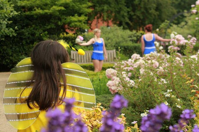 Young people dancing in a garden