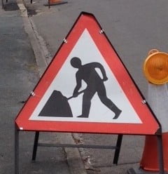 Triangular shaped roadworks sign.