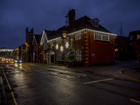 A photo of a building decorated with Christmas lights