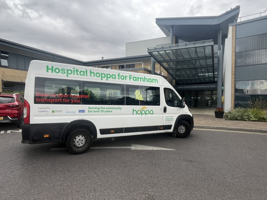 minibus at the entrance to a hospital.
